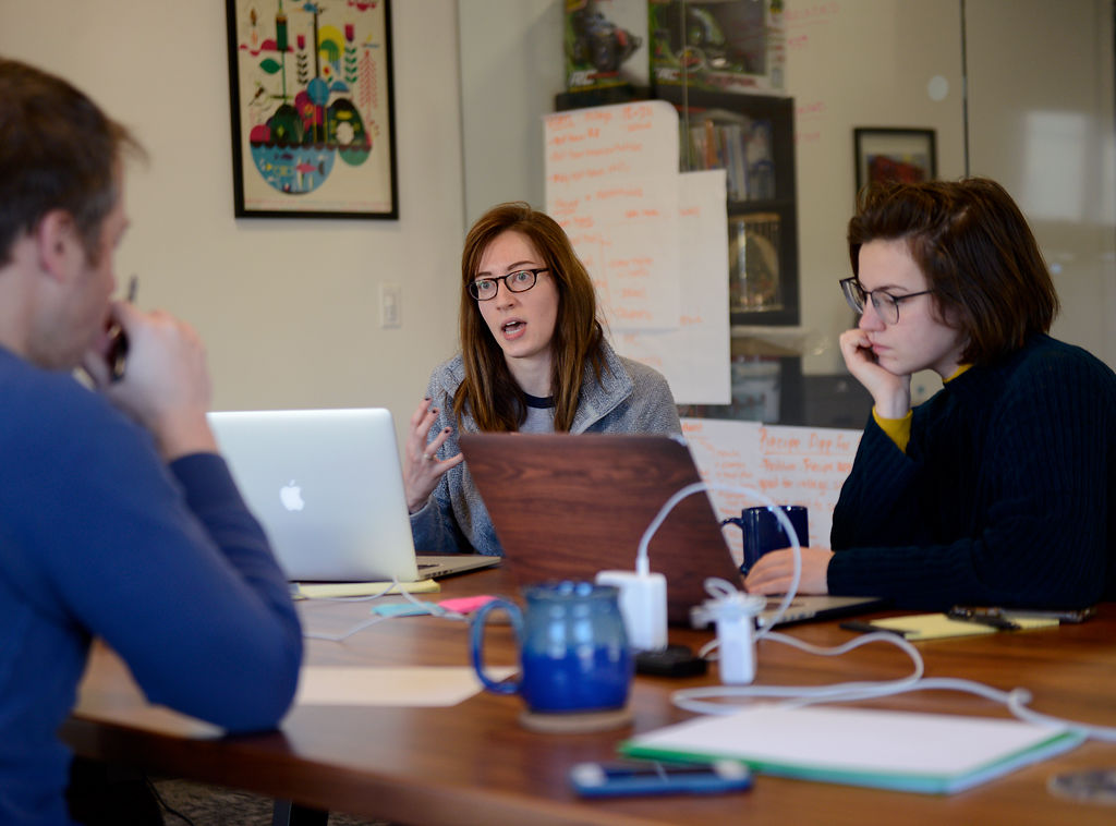 Brett Koonce, Hannah Pratte and Cassie Ferrick hold a marketing meeting